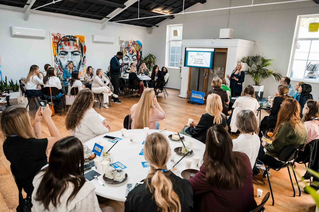 Women at the Supply Chain Women breakfast at DELIVER Europe 2026, listening to a presentation